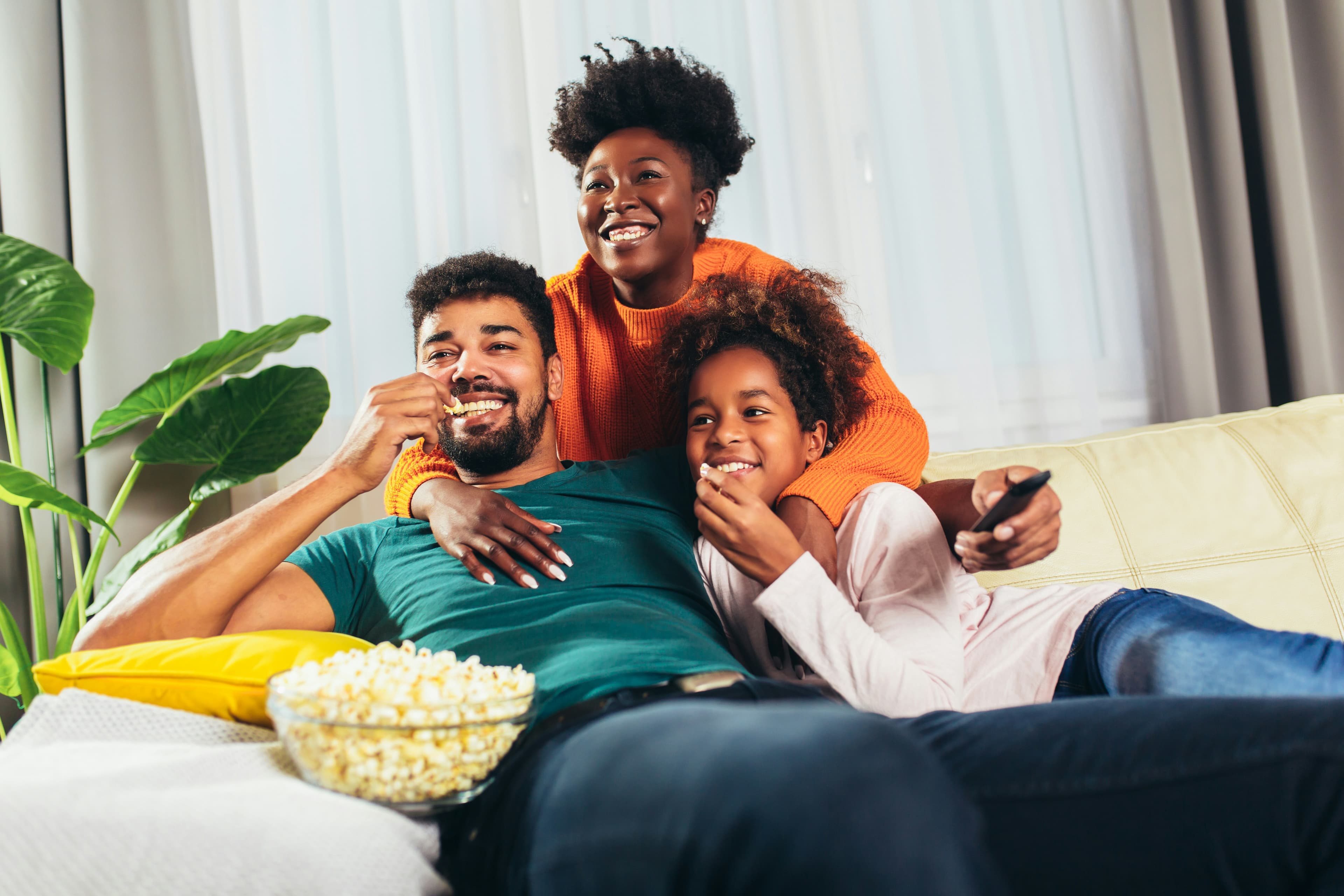 Home theatre setup with family watching